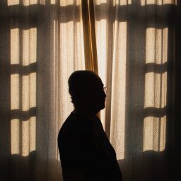 Silhouette of a man indoors.