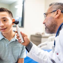 Young boy getting his hearing tested