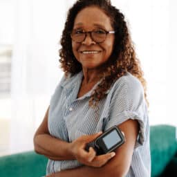 Woman checking her blood sugar levels