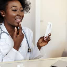Speech pathologist showing correction pronunciation